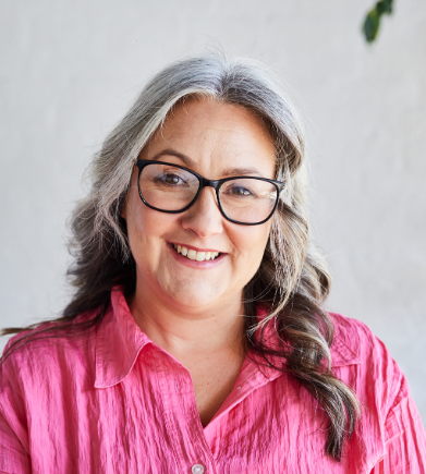 woman grey hair smiling looking at camera